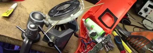 Vacuum cleaner repair parts and tools on a workbench in Tampa, FL